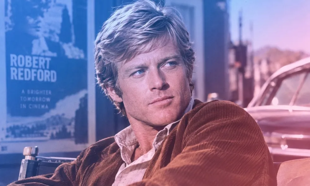 Facezem | Robert Redford: Net Worth, Movies, Sundance and the Legacy He Built Beyond Hollywood Young Robert Redford in a brown jacket sitting outdoors