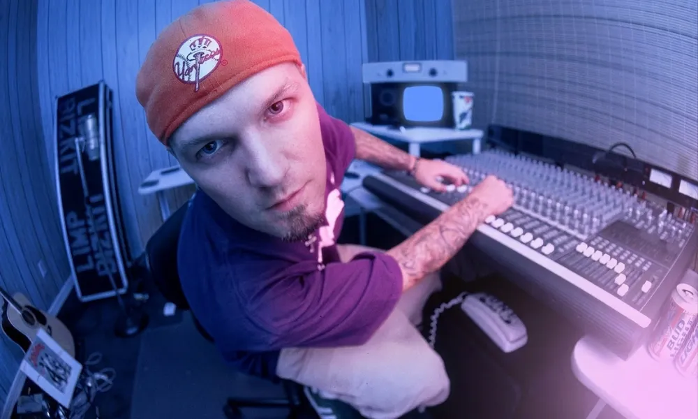 Facezem | Fred Durst Net Worth: How the Limp Bizkit Frontman Built His Fortune, Career and Legacy Fred Durst sitting at an audio mixing console in a recording studio