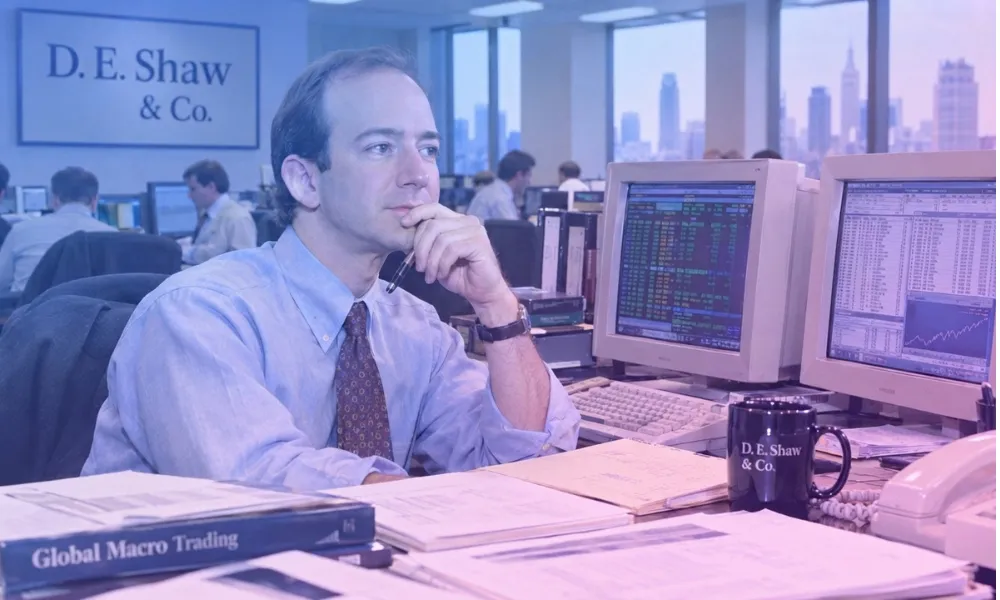 Facezem | How Did Jeff Bezos Start Amazon? The Story Behind Its Beginning Jeff Bezos working at a desk with dual CRT monitors inside the D. E. Shaw & Co. office in New York