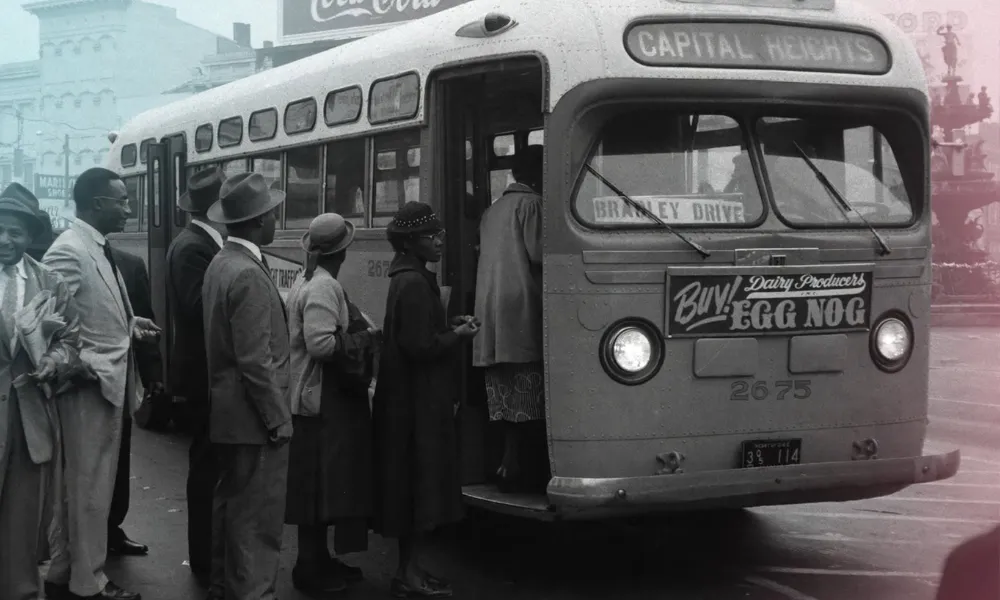 Passengers waiting to board a historical segregated city bus in Montgomery, Alabama.