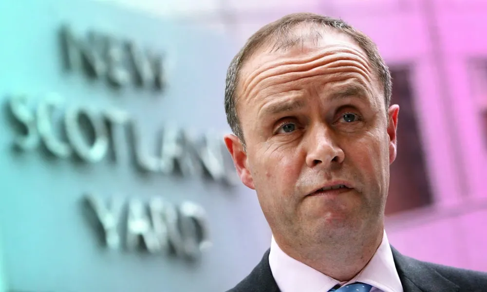 John Yates standing outside a public building-Rags-to-Riches Stories